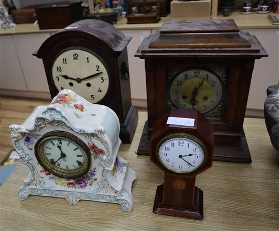 Four assorted wood and ceramic mantel clocks tallest 38cm